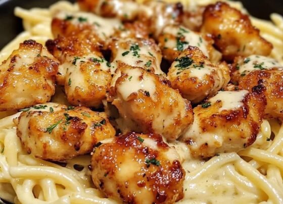 Golden Garlic Chicken Bites over Creamy Parmesan Pasta prepared at home with simple ingredients and clear steps.